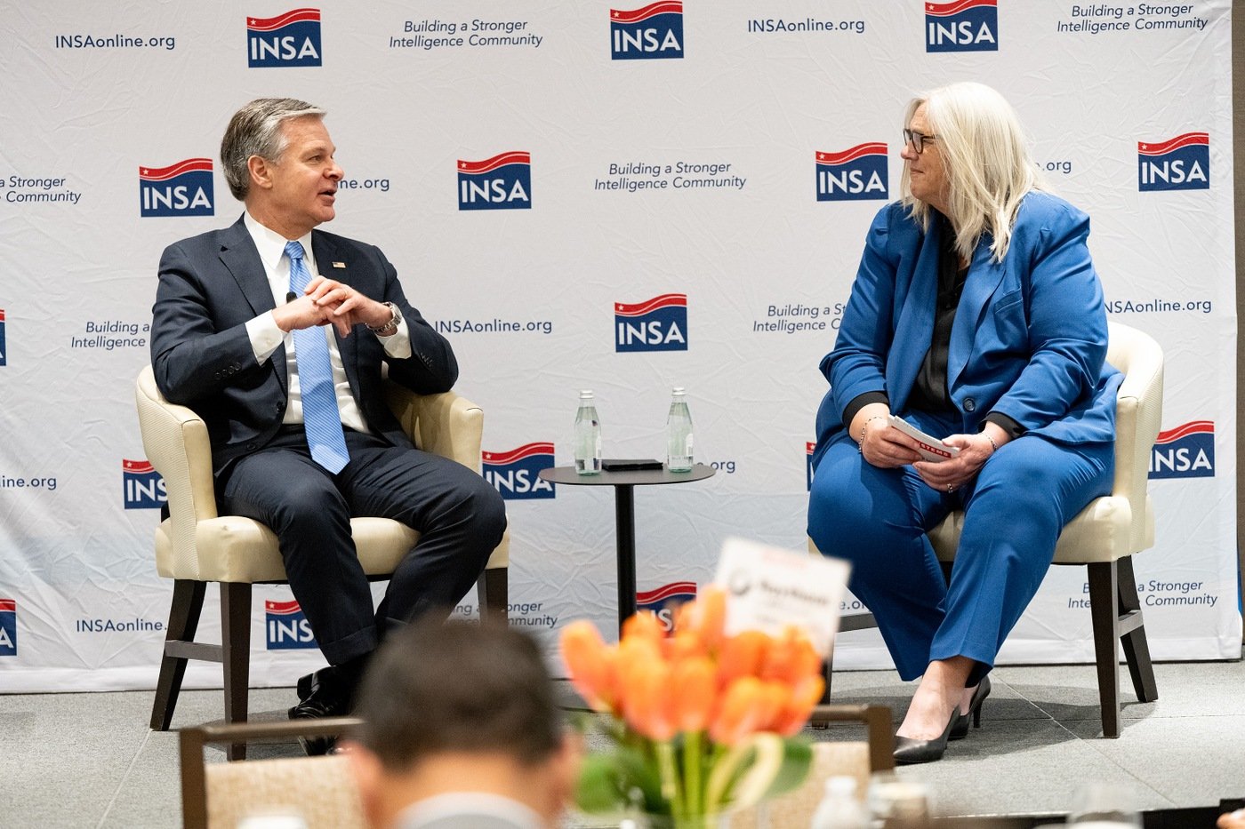 Director Wray and Sue Gordon at INSA summit in McLean, Virginia, on February 29, 2024.