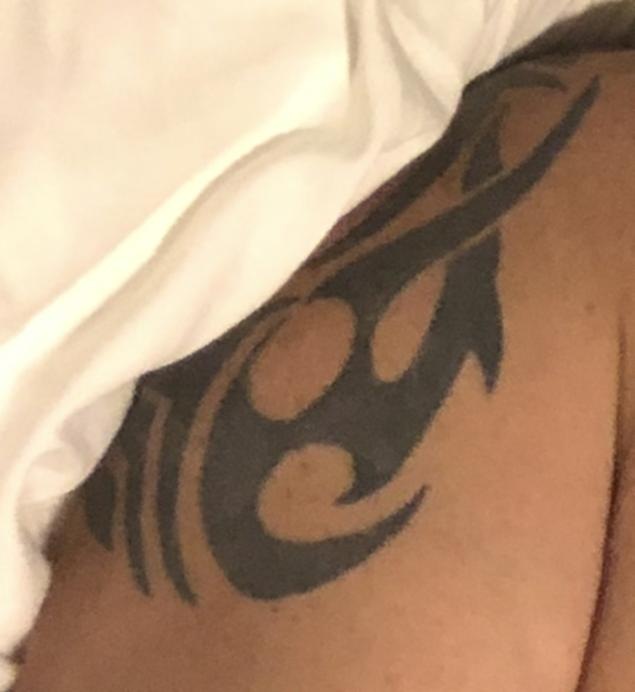Tattoo on right shoulder